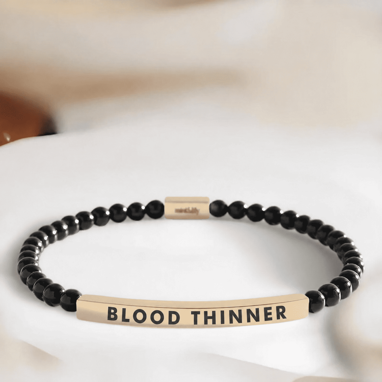 Slim black blood thinner gold